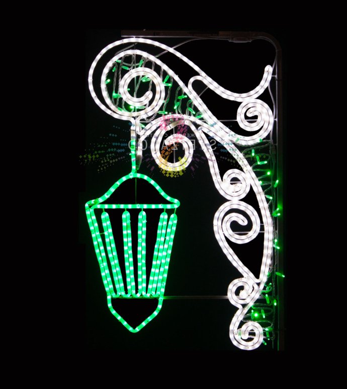 Детальное фото светодиодной консоли Фонарь зеленого цвета с холодным белым свечением, металлический каркас, габариты 110х60х3 см.