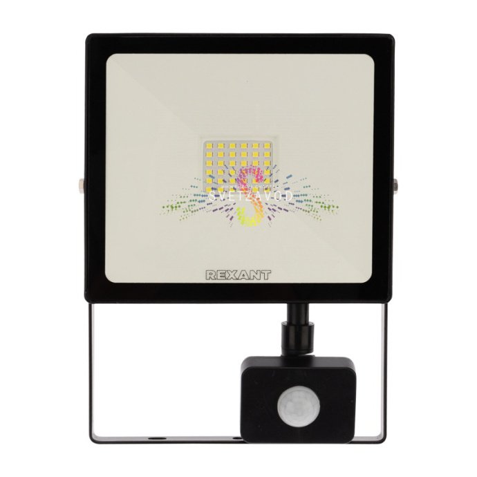 Детальное фото светодиодного прожектора REXANT 50Вт. Видны датчик движения, алюминиевый корпус черного цвета, прозрачное стекло рассеивателя и элементы крепления. Детальное фото светодиодного прожектора REXANT 50Вт. Видны датчик движения, алюминиевый корпус черного цвета, прозрачное стекло рассеивателя и элементы крепления.