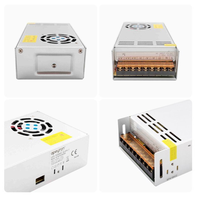 Детальное фото блока питания Apeyron Electrics 12В 400Вт: серебристый корпус, вентилятор, клеммы с маркировкой, IP20.