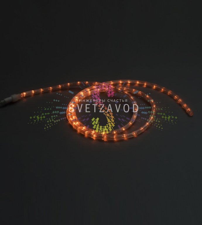 Крупный план оранжевого светодиодного дюралайта диаметром 13 мм с видимыми светодиодами внутри прозрачной гибкой трубки, демонстрирующий конструкцию.