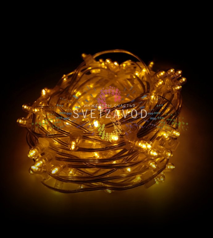 Детальное фото гирлянды Клип Лайт 12В: желтые светодиоды с защитными колпачками на прозрачном ПВХ-кабеле, блок питания в комплекте.