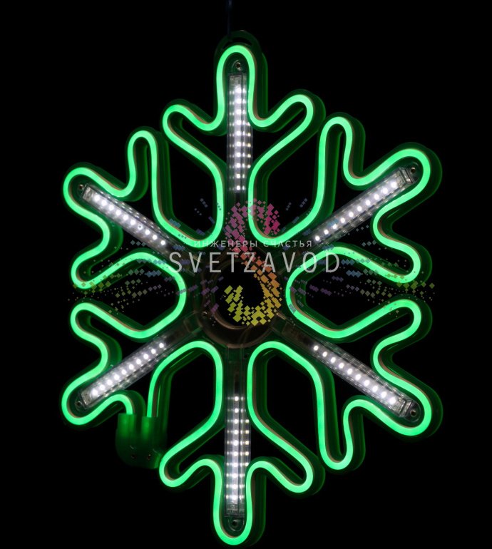 Крупный план зеленой светодиодной снежинки 40 см с неоновым свечением и эффектом тающих сосулек, установленной на фасаде здания.