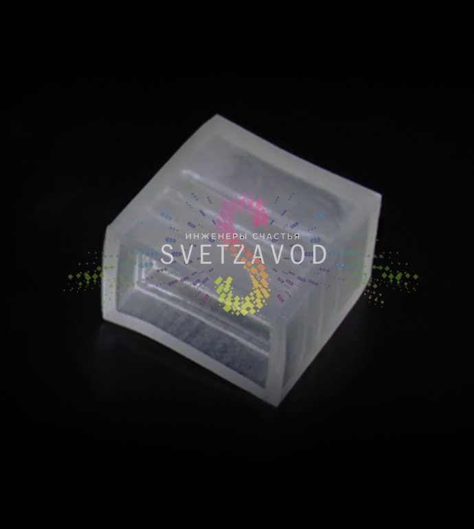 Крупный план пластиковой заглушки для герметизации торца плоского пятижильного светодиодного дюралайта размером 11 на 28 миллиметров.