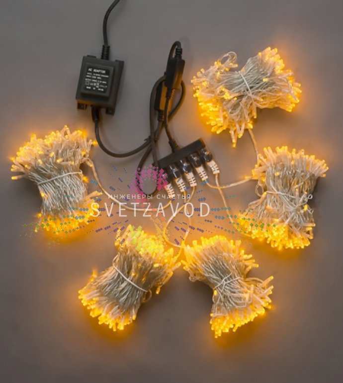 Детальное фото комплекта Клип Лайт Спайдер: 5 прозрачных нитей по 20м с желтыми светодиодами, блок питания 220/24В, упаковка. Видны разветвитель и расстояние между диодами 10 см.